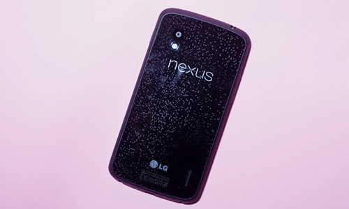LG Nexus 4 smartphone back view with glitter-patterned design and Nexus branding.
