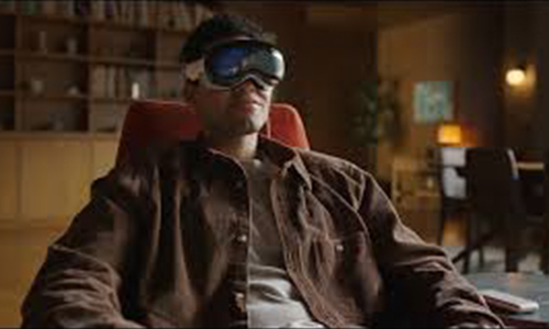 Man sitting in chair wearing apple vision pro