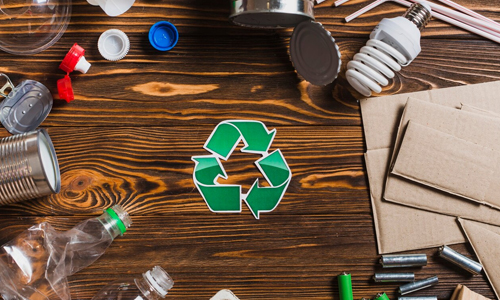 Recycle-items-on-brown-wooden-textured-background