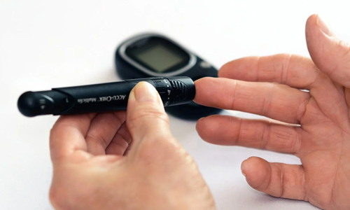 man testing himself with device
