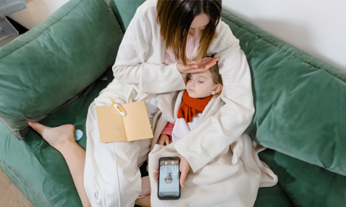 mother taking care of sick child