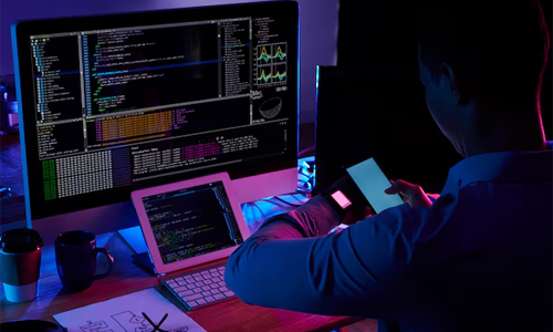 Man sitting in front of systems